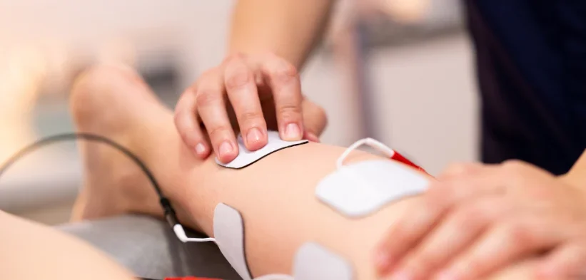 A person receiving functional e-stim.