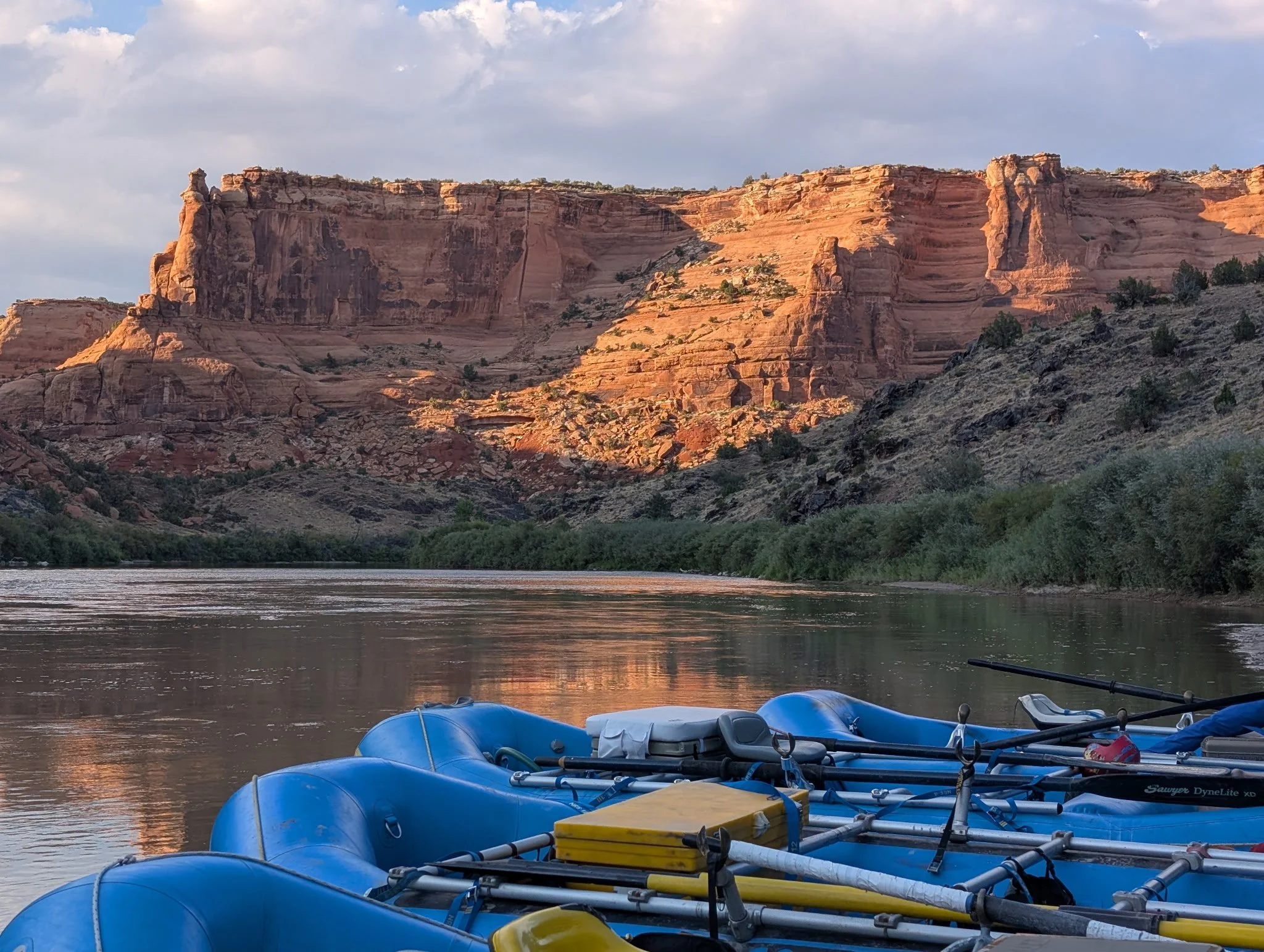 Family-friendly rafting trip on the Upper Colorado River with kids splashing water between rafts under mountain views