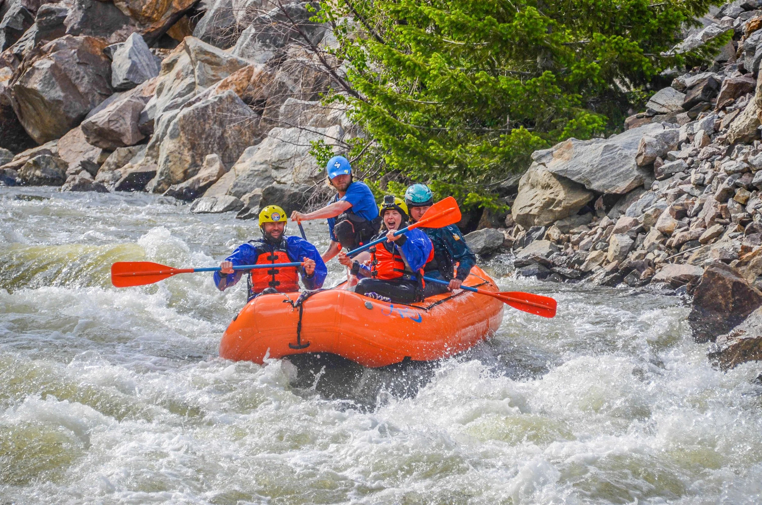 Group whitewater rafting through a rapid on Clear Creek in Idaho Springs, Colorado.