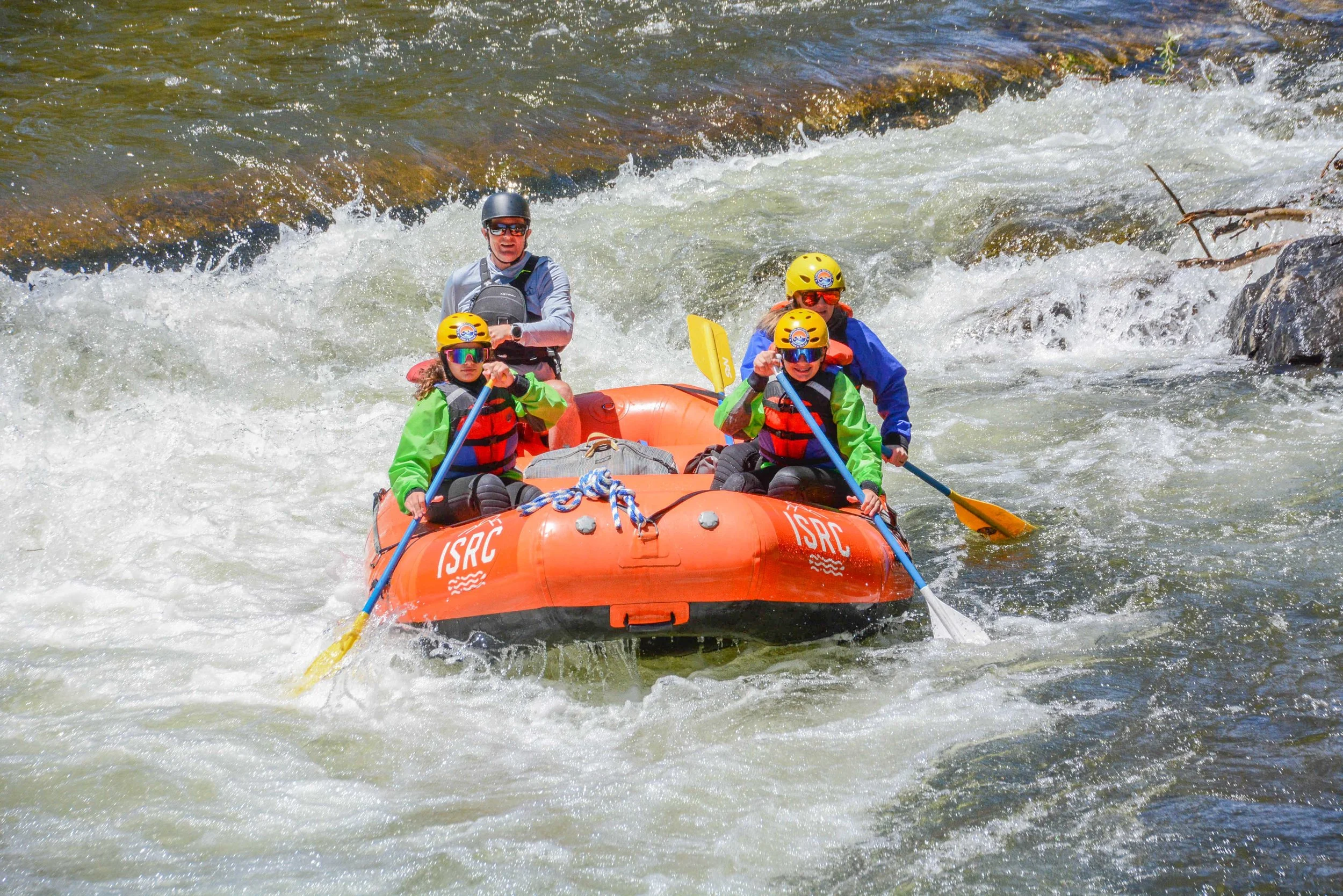 Family of 3 enjoying the whitewater rafting