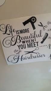 Decorative sign with a hairdresser theme featuring scissors, a comb, and a hairdryer, with the quote 'Life is more beautiful when you meet the hairdresser'.