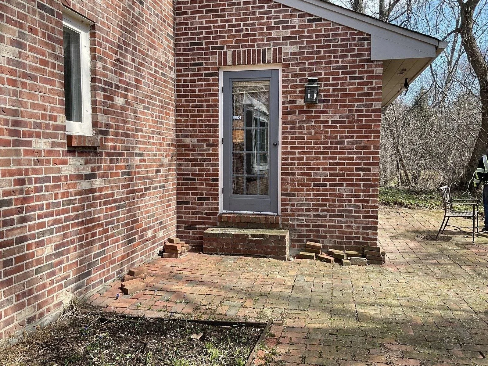 Settled brick paver patio around a settled room