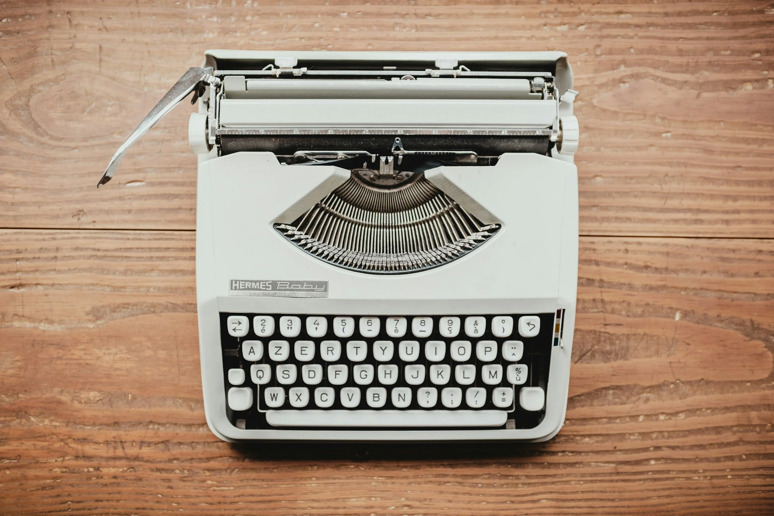 old typewriter - on wooden table