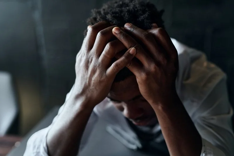 depressed man, head in hands