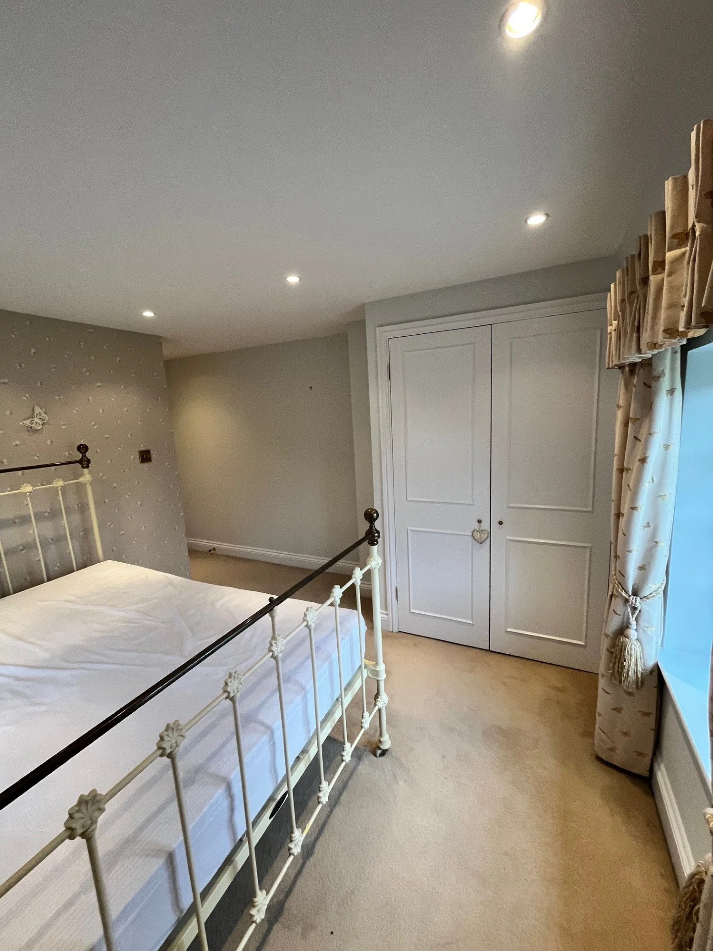 Bedroom painting and wallpapering in Dedham, Essex clean professional finish by Bergman Decorations