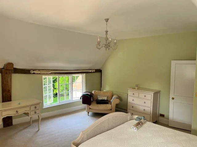 Bedroom decorated in Dedham, Essex with green painted walls and a clean finish by Bergman Decorations