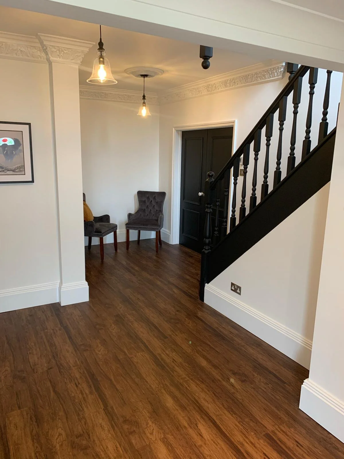 Entrance hall and staircase redecoration with white walls, decorative coving and black staircase finished in Little Green Estate Eggshell in Manningtree