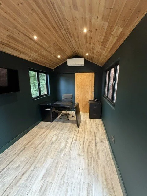 Garden room home office in Sandon, Chelmsford, decorated in Dulux Heritage Mallard Green with a natural timber vaulted ceiling and Mallard Green woodwork.