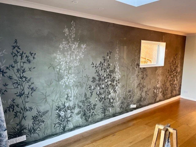 Living room feature wall mural wallpaper installation in Walton-on-the-Naze, Essex. By Bergman Decorations.