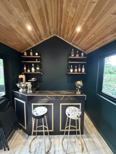 Bespoke garden room bar in Sandon, Chelmsford, featuring Dulux Heritage Mallard Green walls and woodwork.