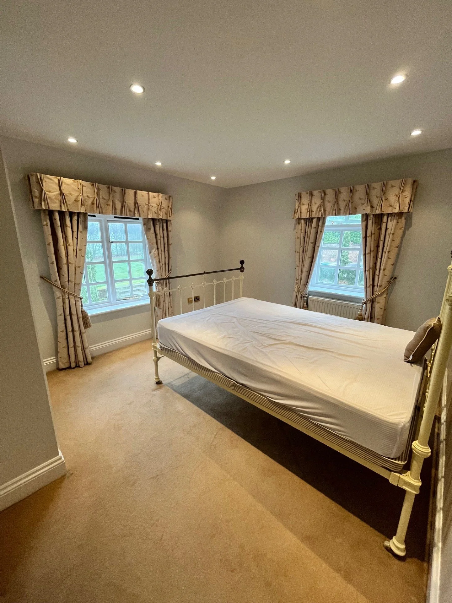 Bedroom wallpapering and decorating in Dedham, Essex including windows and woodwork by Bergman Decorations