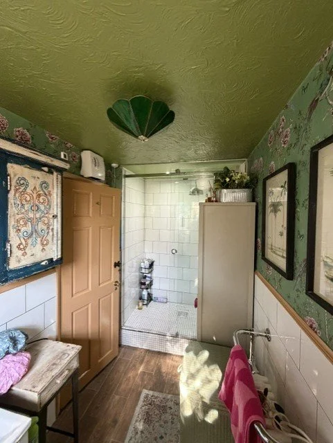 Traditional bathroom redecoration completed in Tollesbury, Essex, with wallpapered walls, refreshed painted ceiling and professionally finished woodwork for a durable, characterful finish.