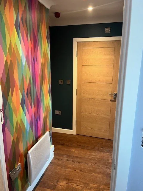 Hallway decorating and wallpaper installation in Colchester, Essex modern feature wall by Bergman Decorations