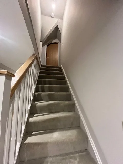 Hall, stairs and landing painting completed in Sandon, Essex with clean lines and a smooth finish.