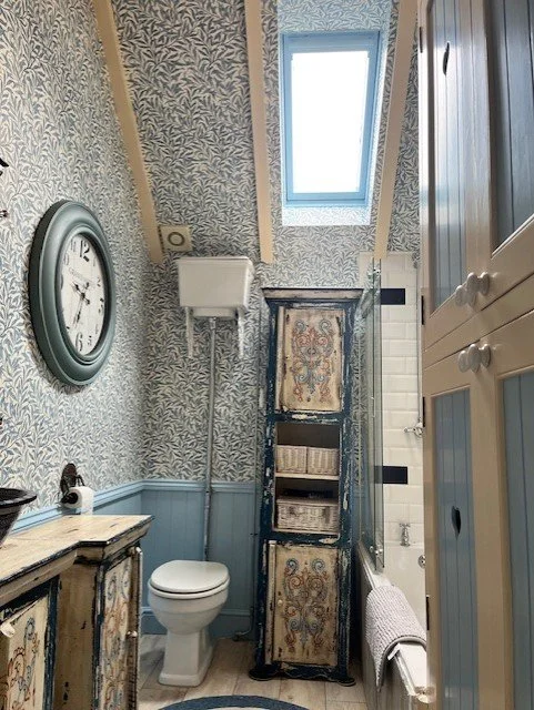 Bathroom full redecoration including wall and ceiling wallpaper installation in Tollesbury, Essex by Bergman Decorations