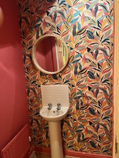 Cloakroom wallpaper installation and feature wall in Colchester, Essex clean finish by Bergman Decorations