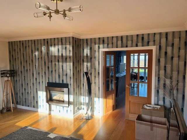 Modern living room wallpaper installation in Maldon, Essex feature wall finish by Bergman Decorations