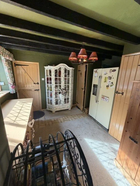 Professional kitchen painting in Tollesbury, bringing new life to this period property while complementing its original timber features and country-style finish.