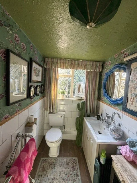 Traditional bathroom redecoration completed in Tollesbury, Essex, with wallpapered walls, refreshed ceiling and professionally finished woodwork for a durable, characterful finish.