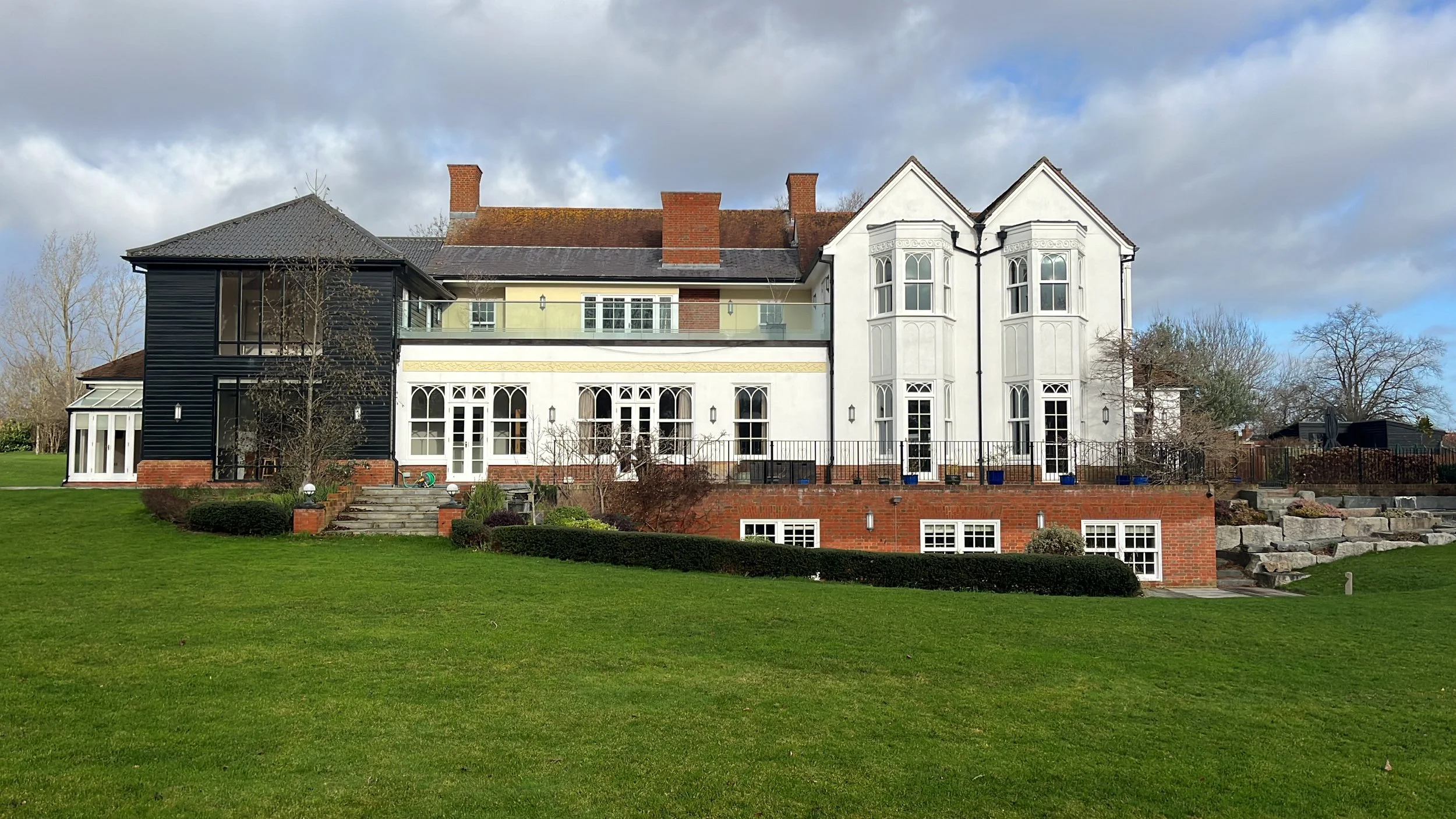 Exterior house painting in Wickham Bishops with masonry and cladding finish on large property.
