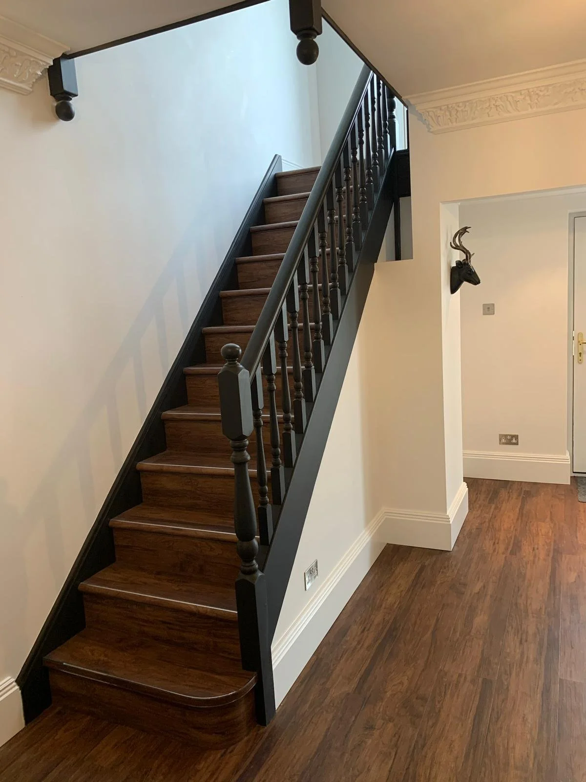 Staircase painted black using Little Green Estate Eggshell in Manningtree