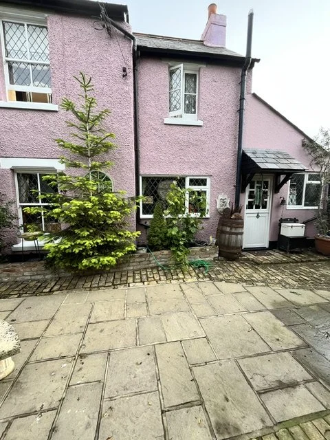 Exterior redecoration of a rendered home in Tollesbury completed by Bergman Decorations.