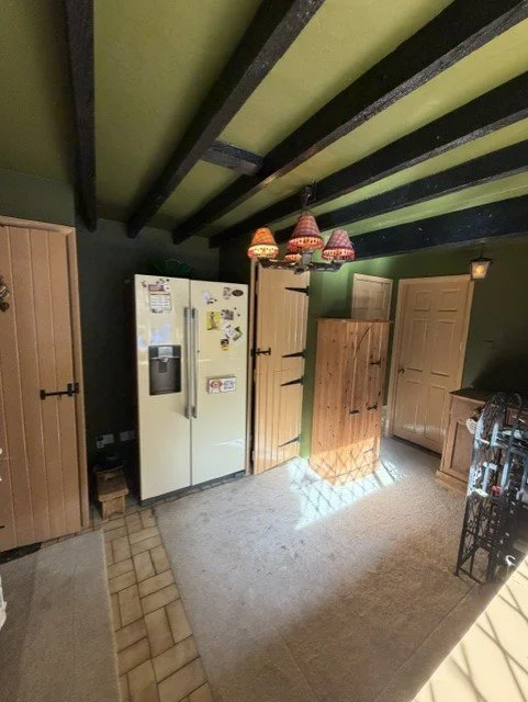 Kitchen transformation highlighting the freshly decorated walls and ceiling alongside restored timber beams for a timeless finish in this Essex home.