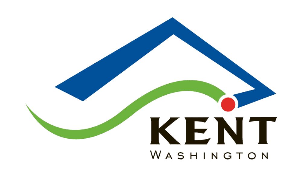 Logo of Kent Washington featuring a stylized house with a blue triangular roof and a green swoosh, with a red dot near the roofline, and the words 'KENT Washington' beneath.