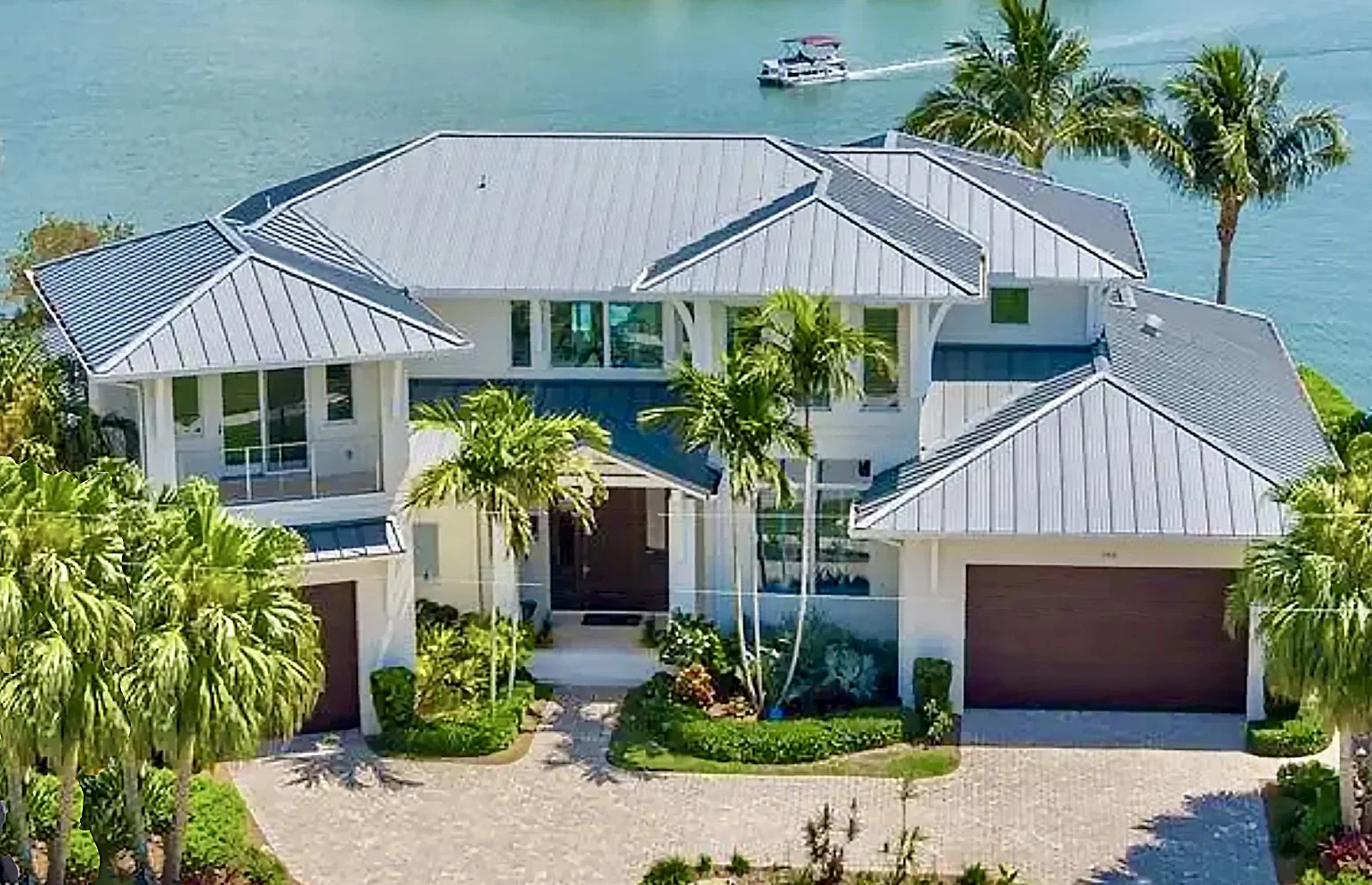 Waterfront tropical boat home on Marco Island in Southwest Florida