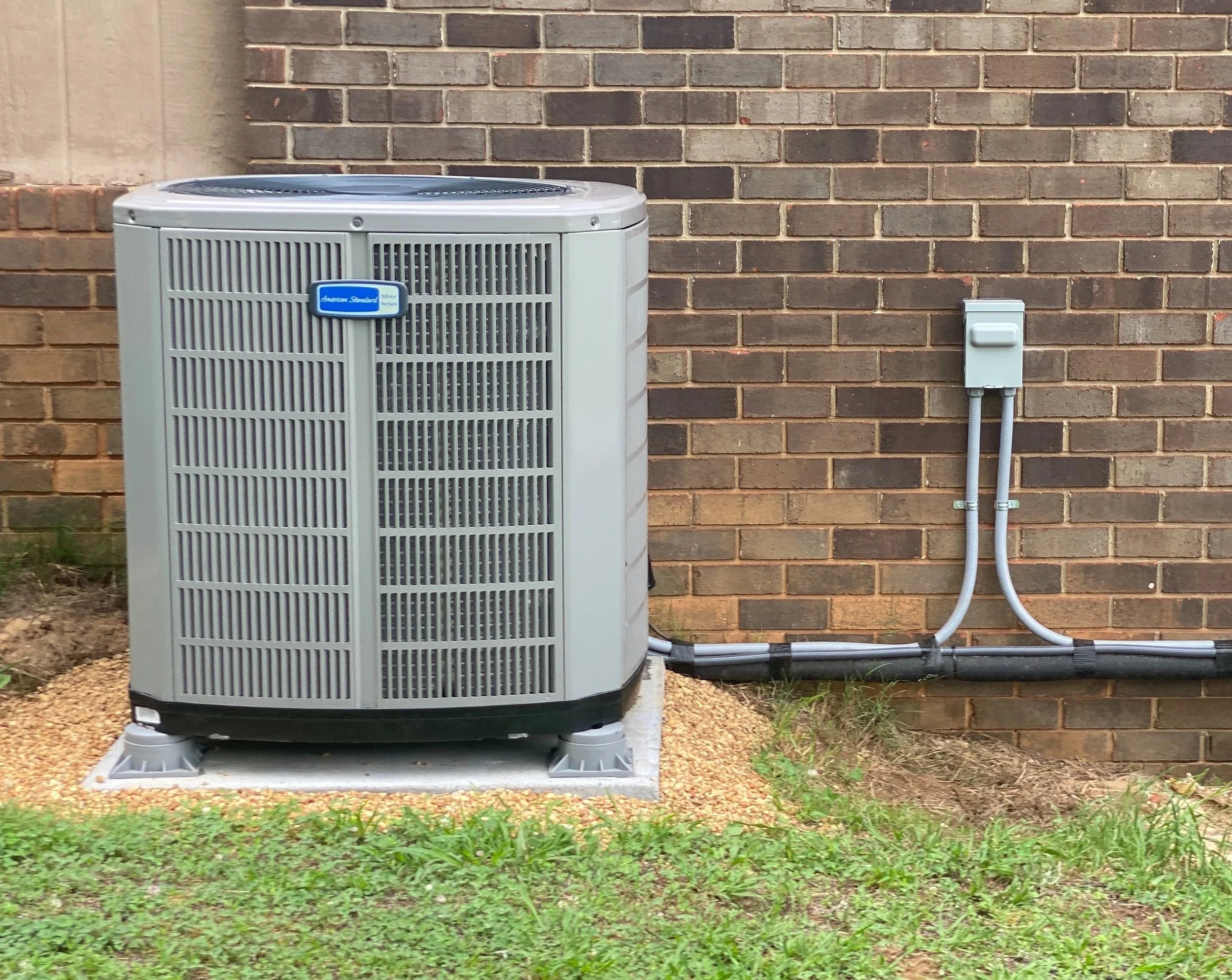 HVAC Replacement set on a concrete pad and 3" risers