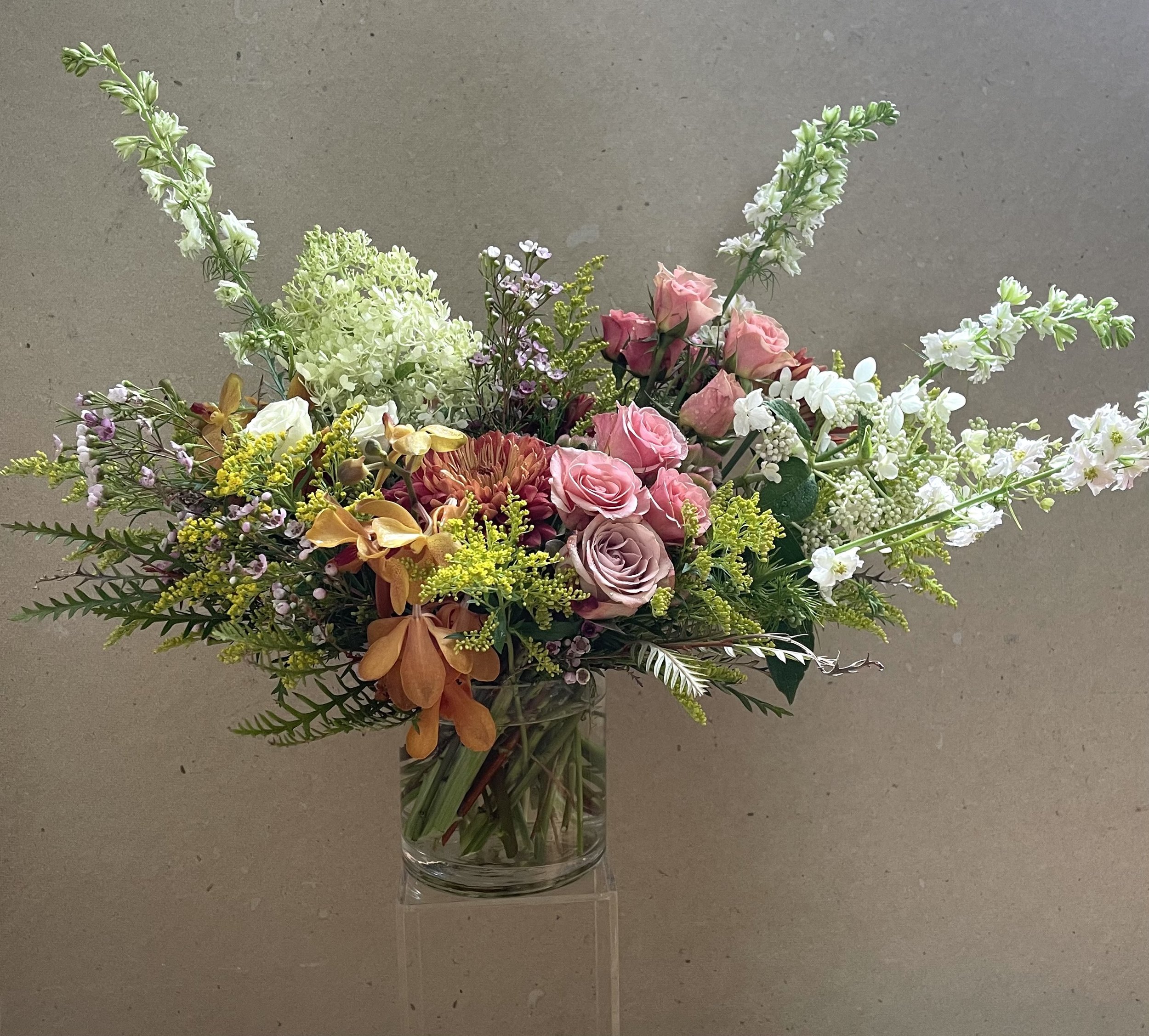 Flower+arrangement+with+bronze+orchids+roses+solidago+larkspur.jpg