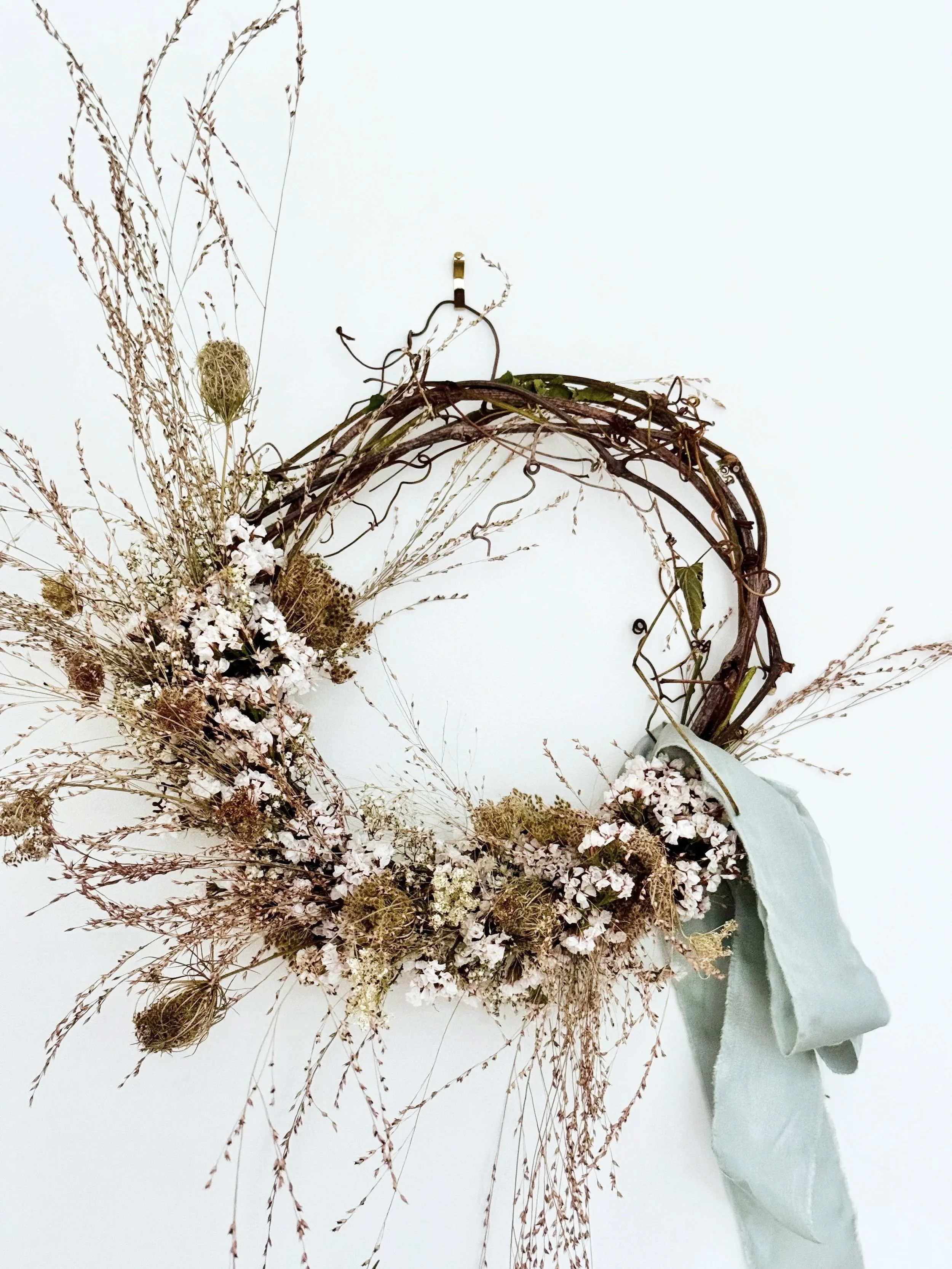 Wreath%2BNo%2B3%2Blight%2Bblue%2Bsilk%2Bribbon%2Bdried%2Bgrasses%2Bpink%2Bstatice.jpg