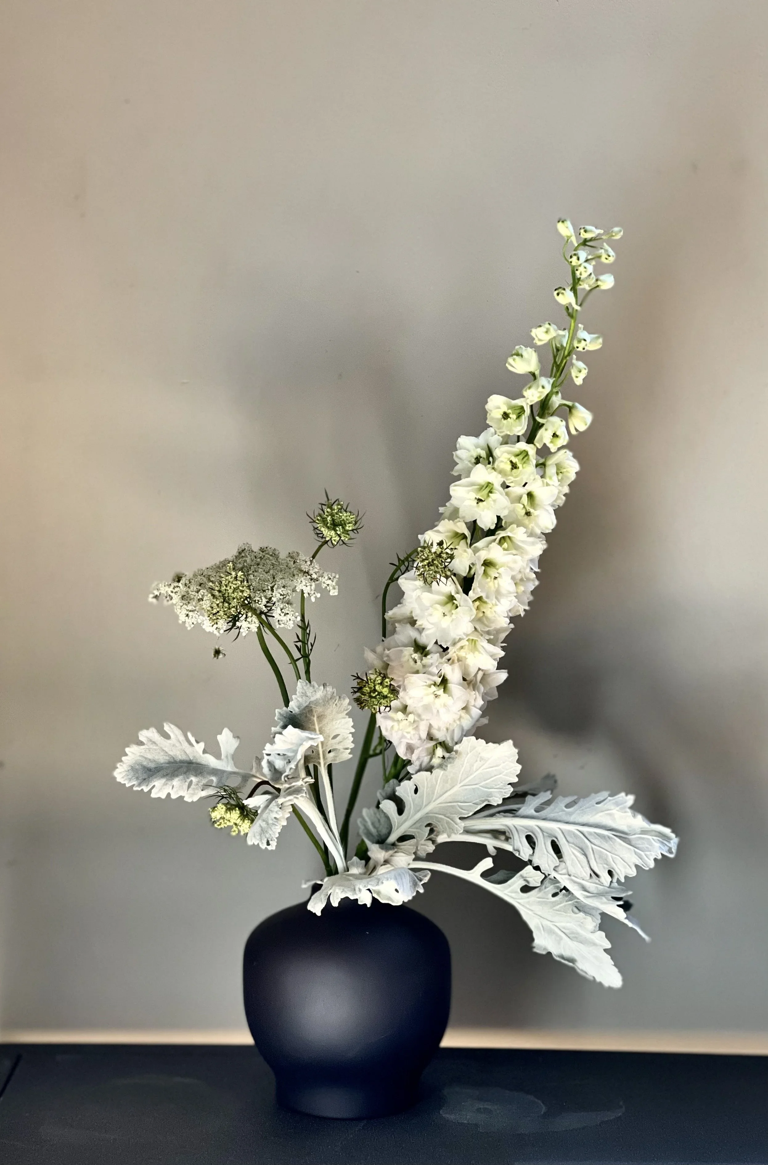 Black+Blossom+Vase+with+Dusty+Miller+Delphinium.webp
