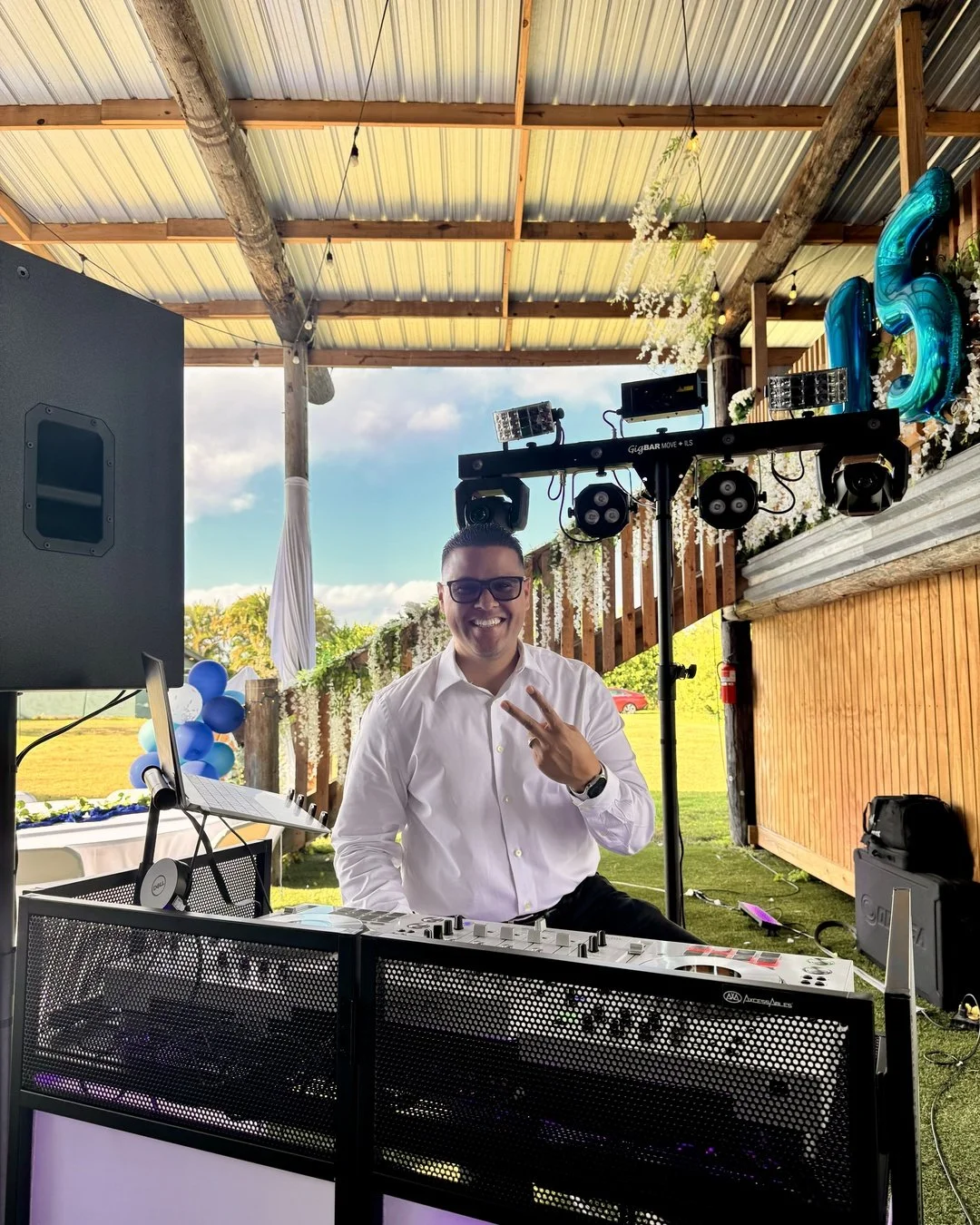 DJ Zapmar setup at a Miami quinceañera during the day