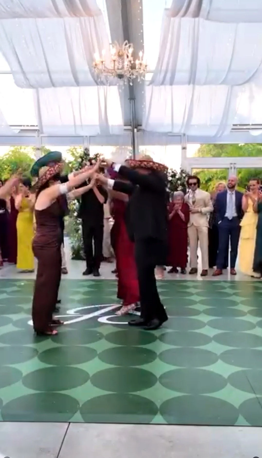 Wedding party dancing together on the reception floor at a DJ Zapmar wedding in Miami