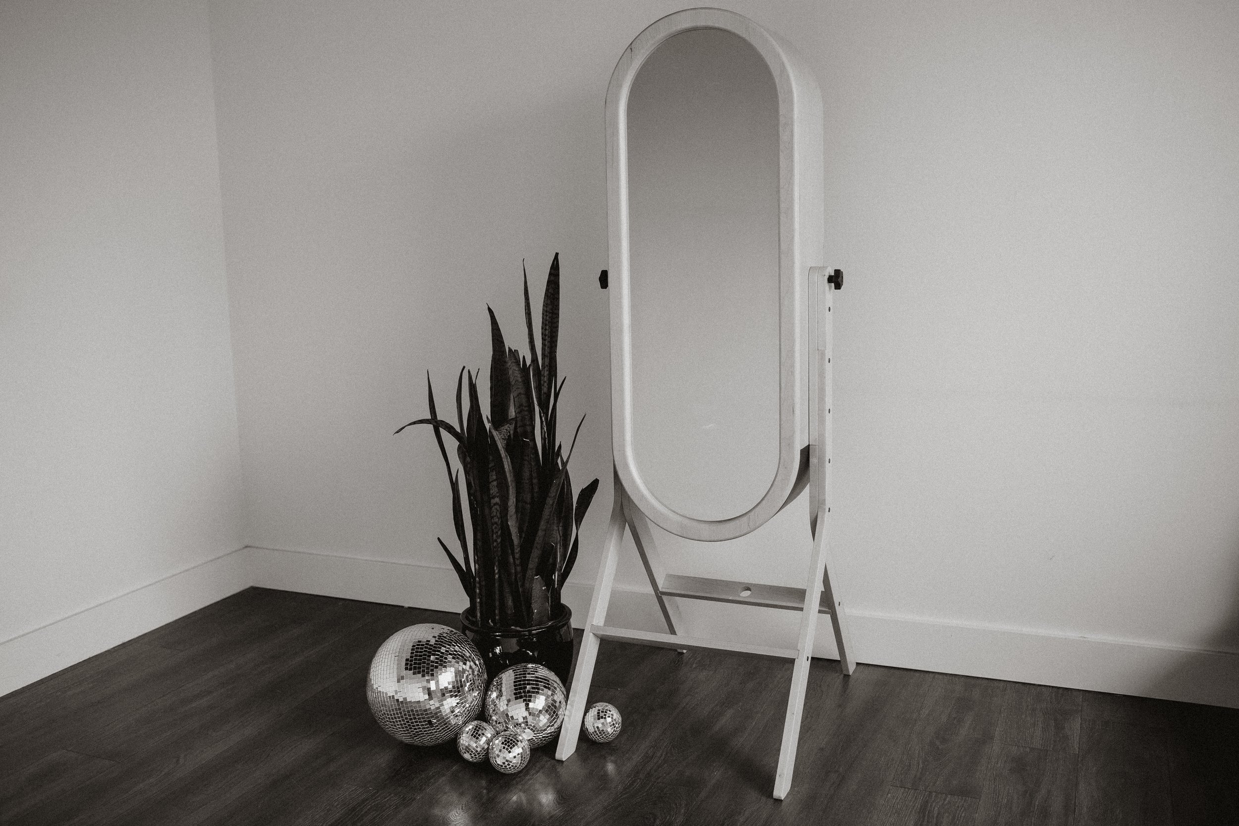 Modern mirror photo booth rental with wood frame and stylish setup