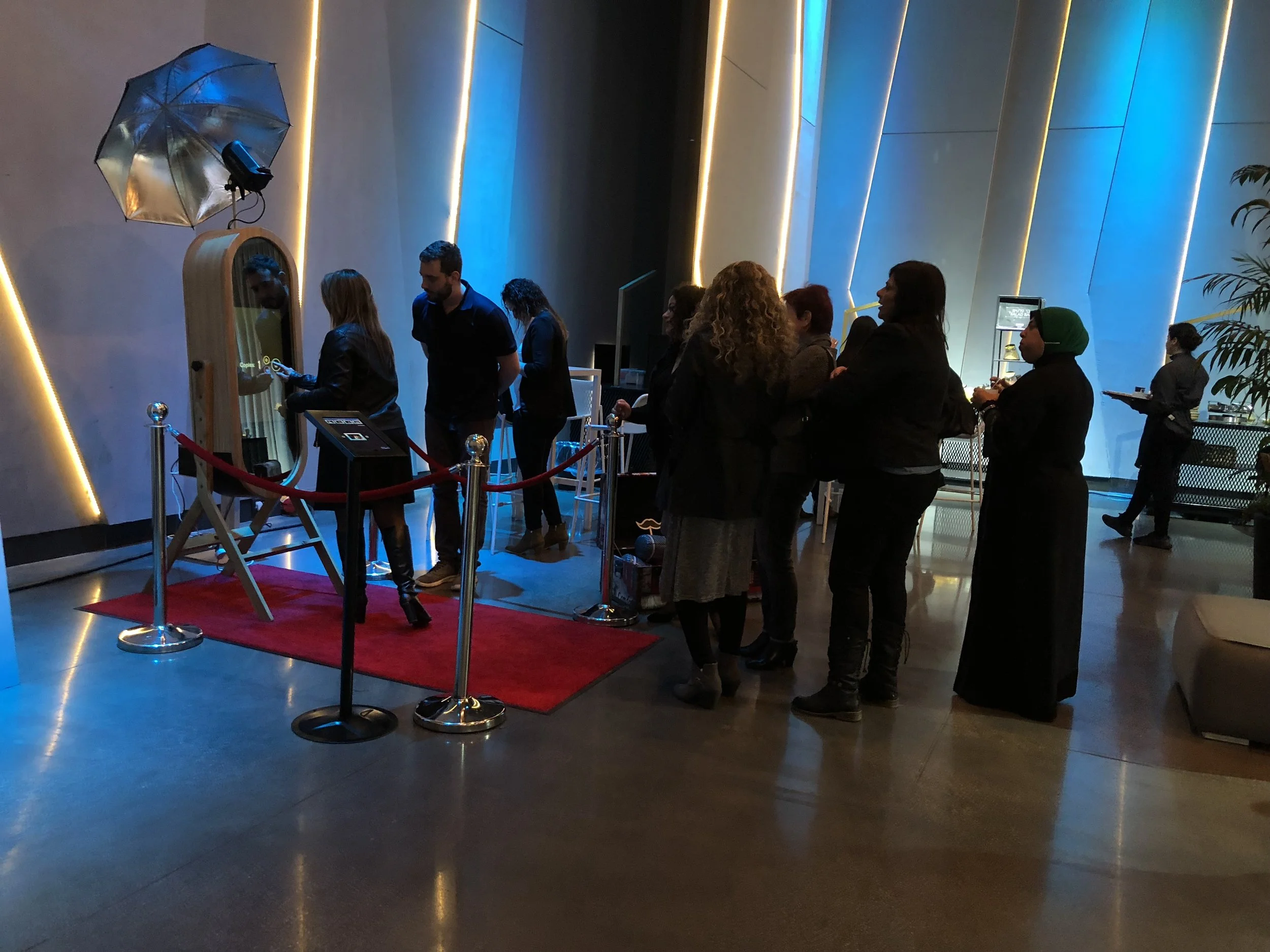 Corporate event photo booth with red carpet setup