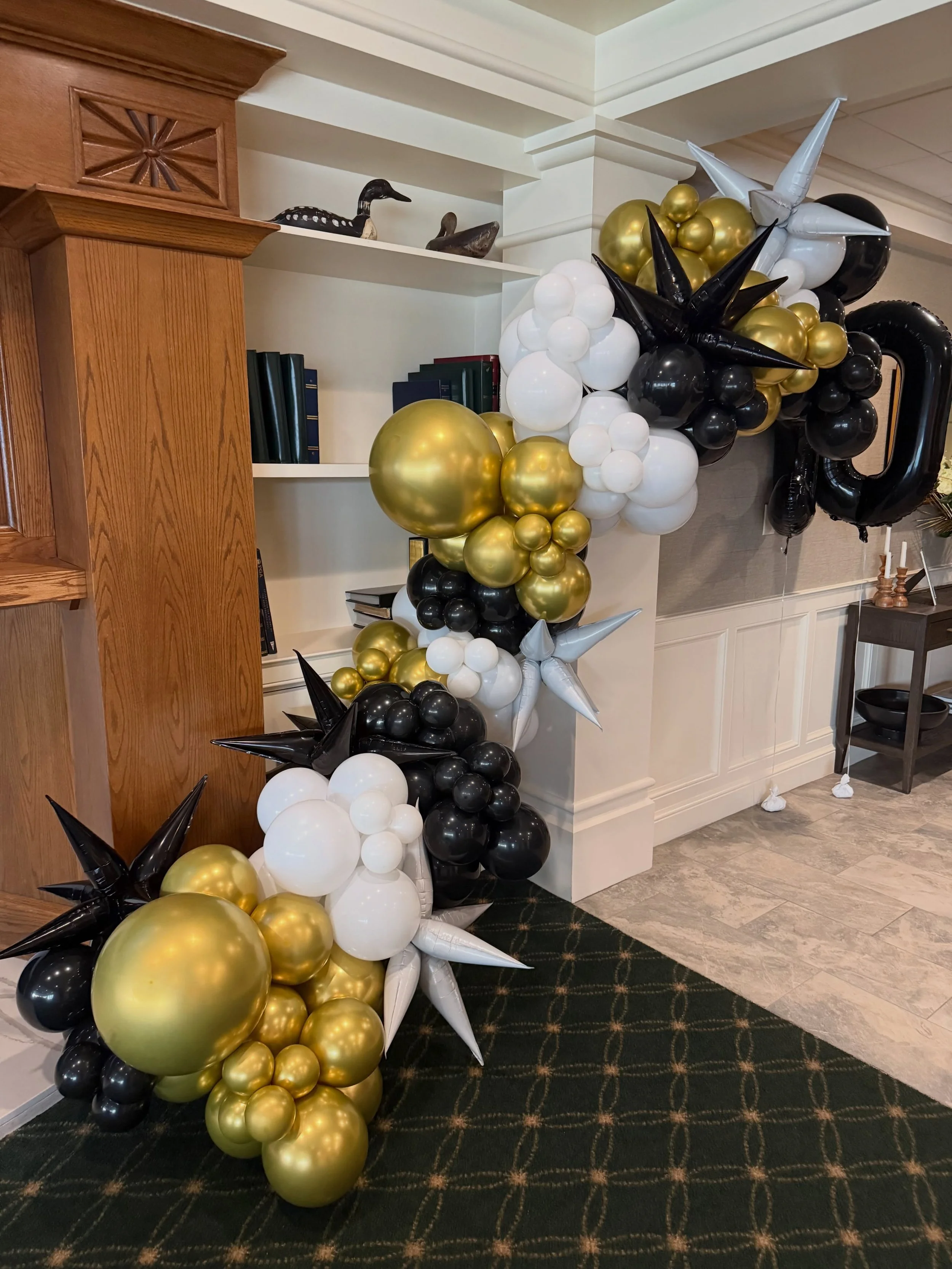 Black, gold, and a whole lot of wow. The vibes are immaculate for this milestone. 🎈👑