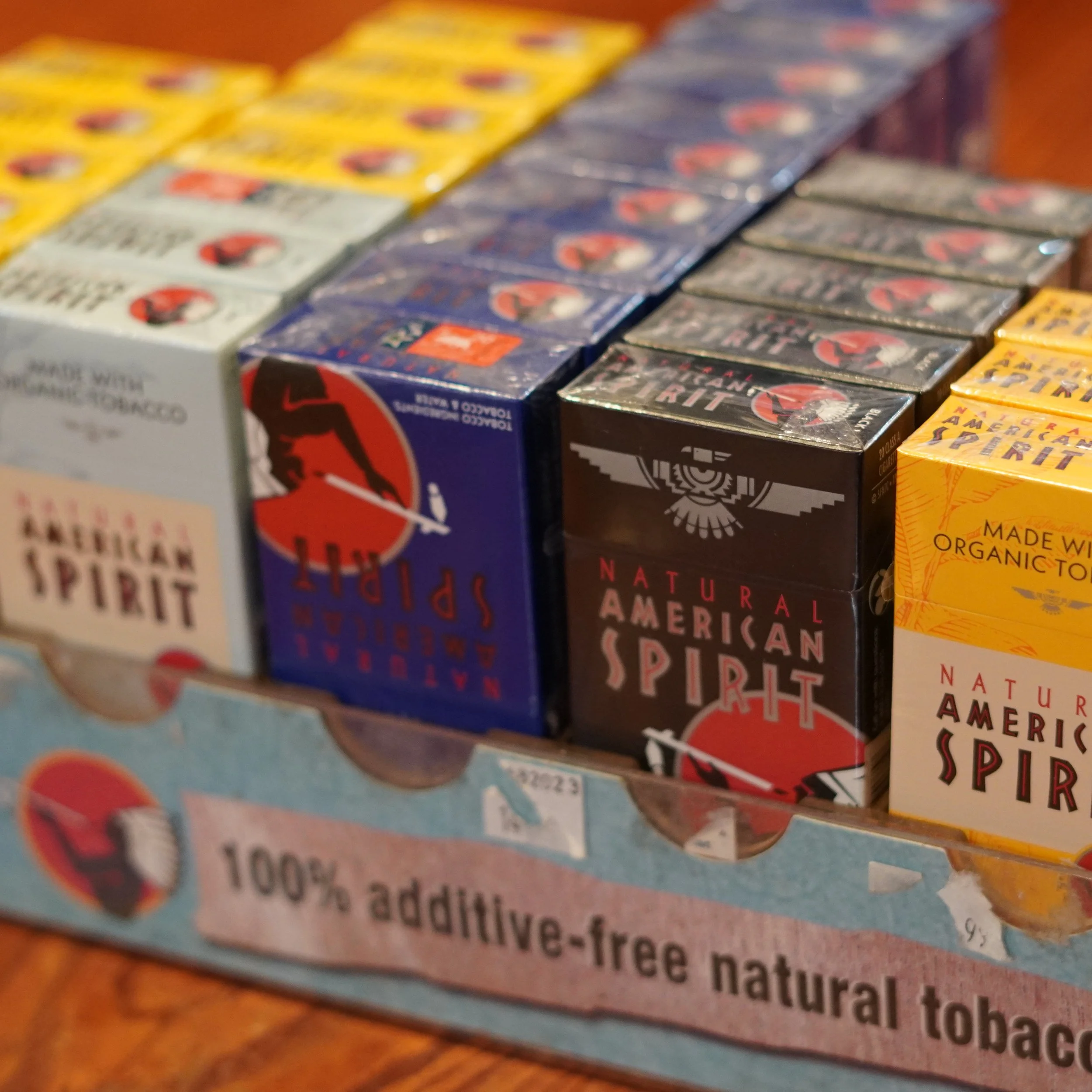 Various packs of natural American Spirit cigarettes arranged on a shelf, with a sign indicating they are 100% additive-free natural tobacco.
available at The French Kitchen , one-stop shop on 4th Fllor of The Westin Bonaventure Hotel
