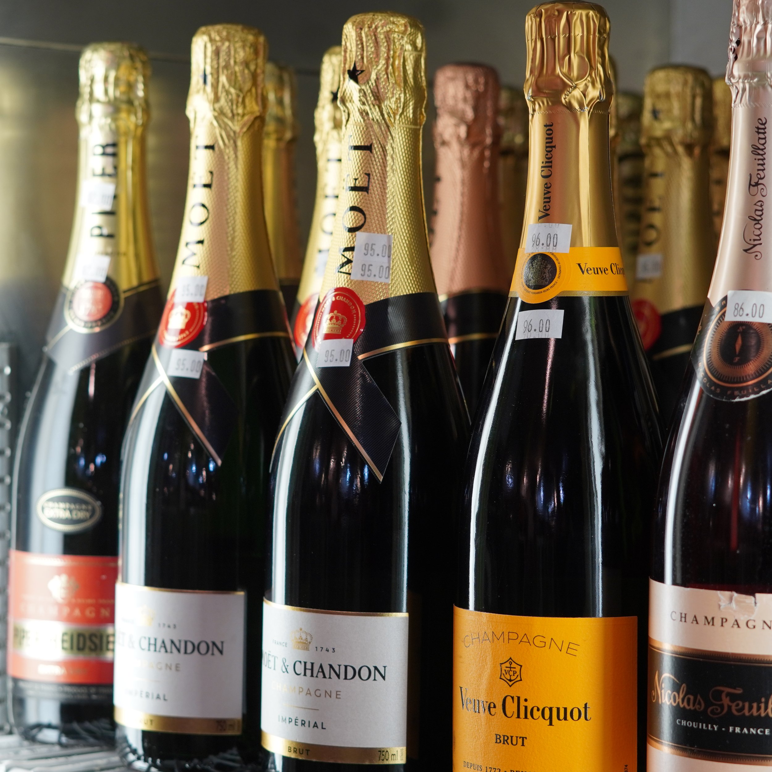 A shelf of various bottles of champagne, including Veuve Clicquot, Moët & Chandon, and Nicolas Feuillatte, with price tags visible.
available at The French Kitchen , one-stop shop on 4th Fllor of The Westin Bonaventure Hotel