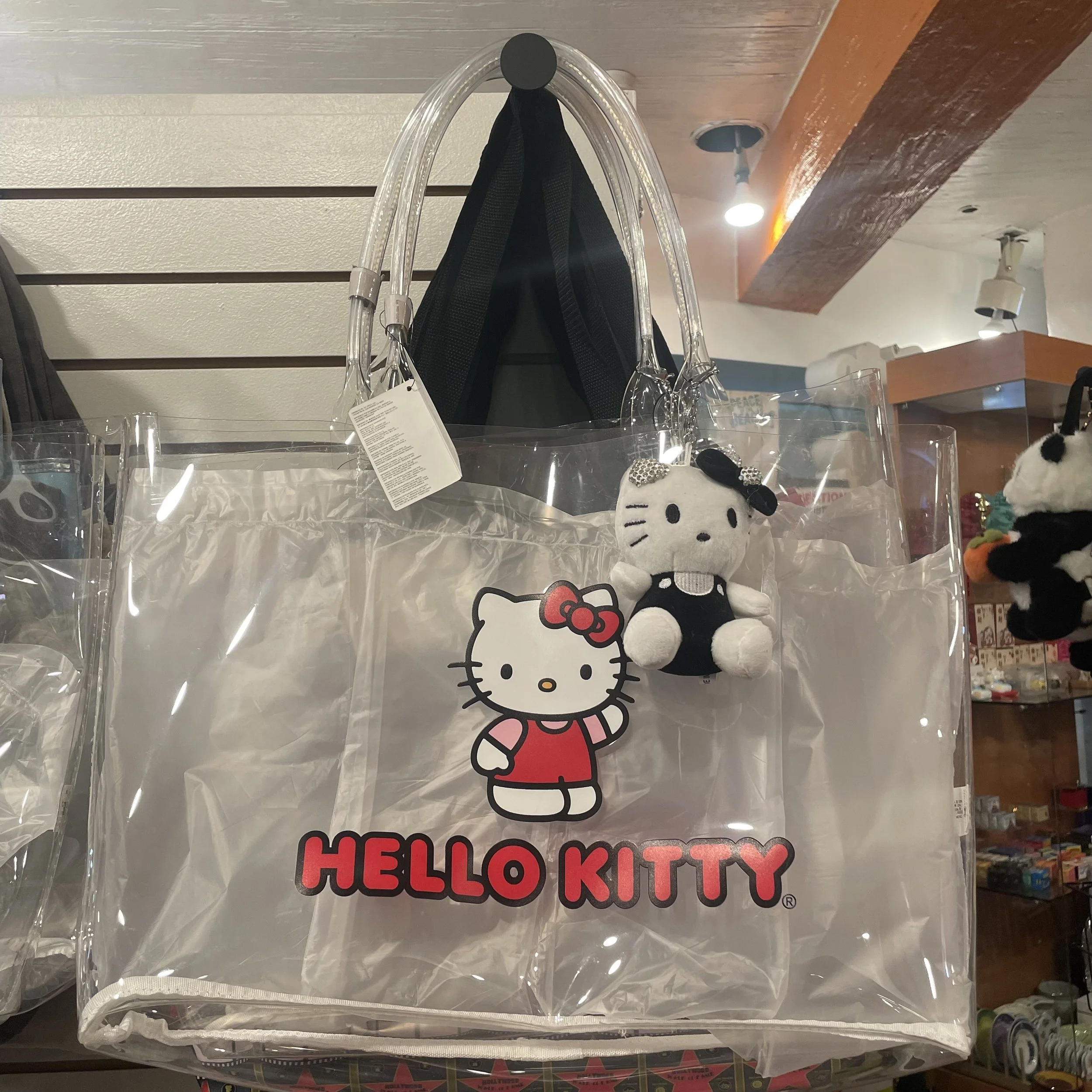 Clear Hello Kitty tote bag with charm, on display inside The Westin Bonaventure Hotel at The French Kitchen Convenience & Liquor Store