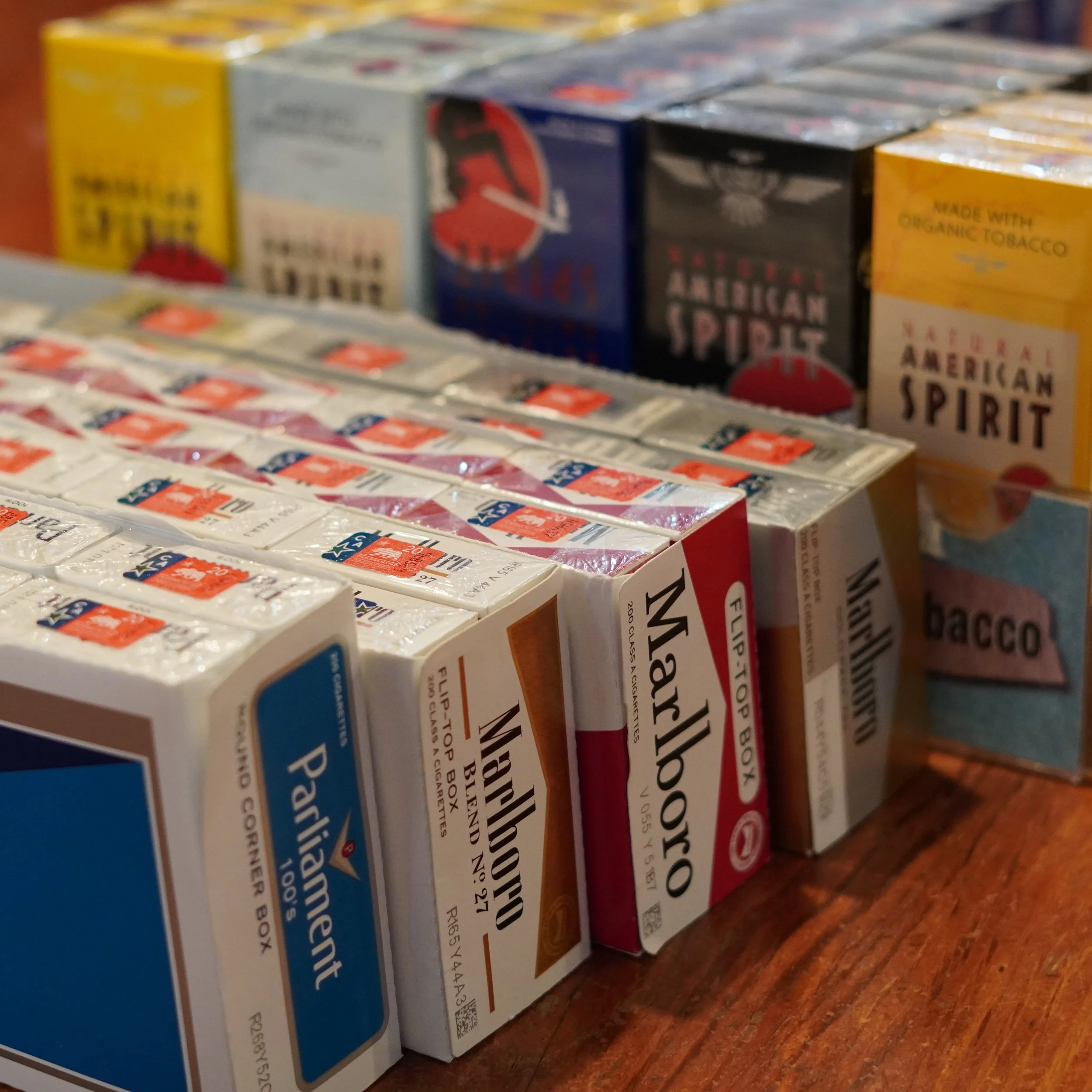 Assorted packs of cigarettes on a wooden surface, including Marlboro, Parliaments, and Natural American Spirit brands.
available at The French Kitchen , one-stop shop on 4th Fllor of The Westin Bonaventure Hotel