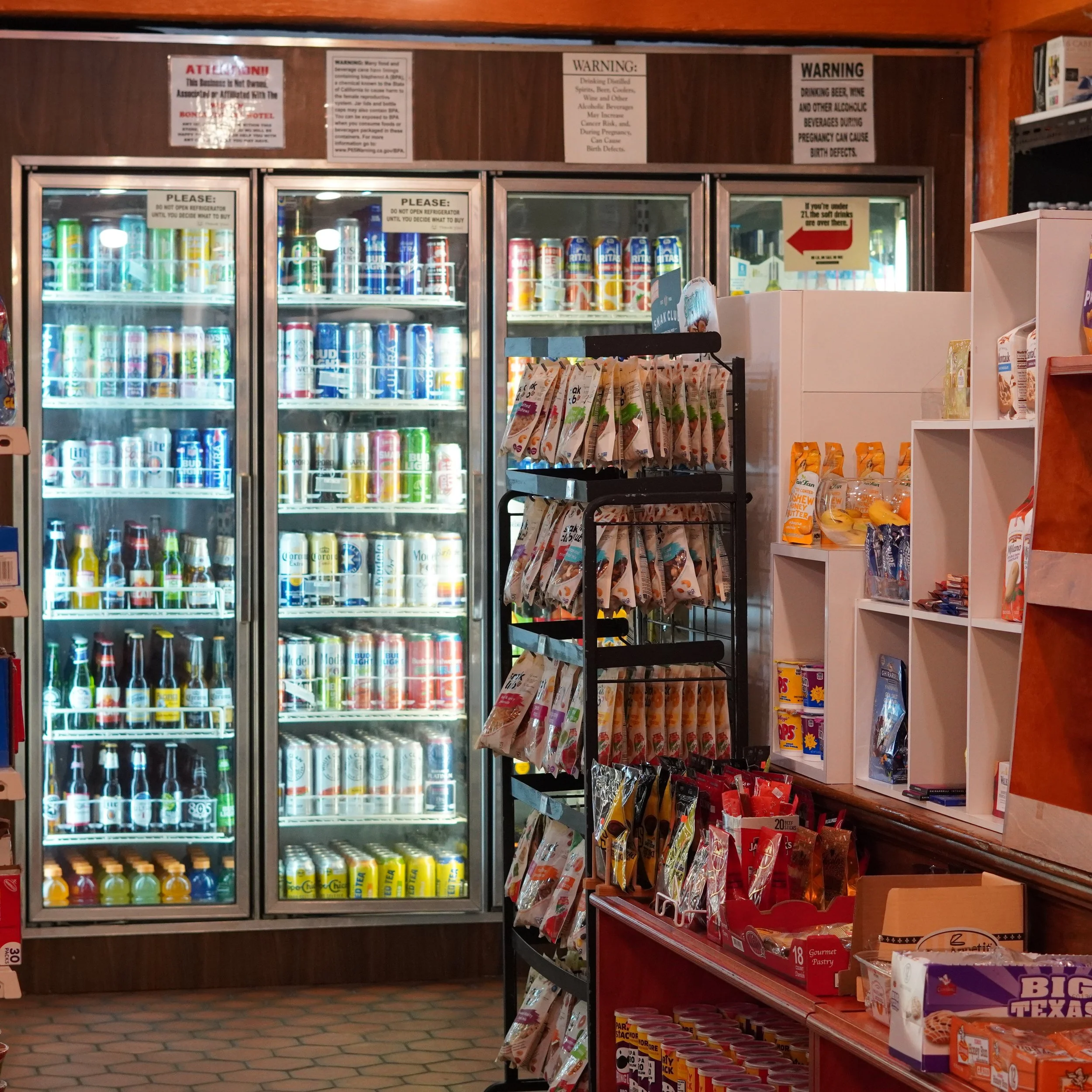 Refrigerators filled with various canned and bottled beverages in a convenience store. Shelves with snacks and candy in the foreground.
available at The French Kitchen , one-stop shop on 4th Fllor of The Westin Bonaventure Hotel