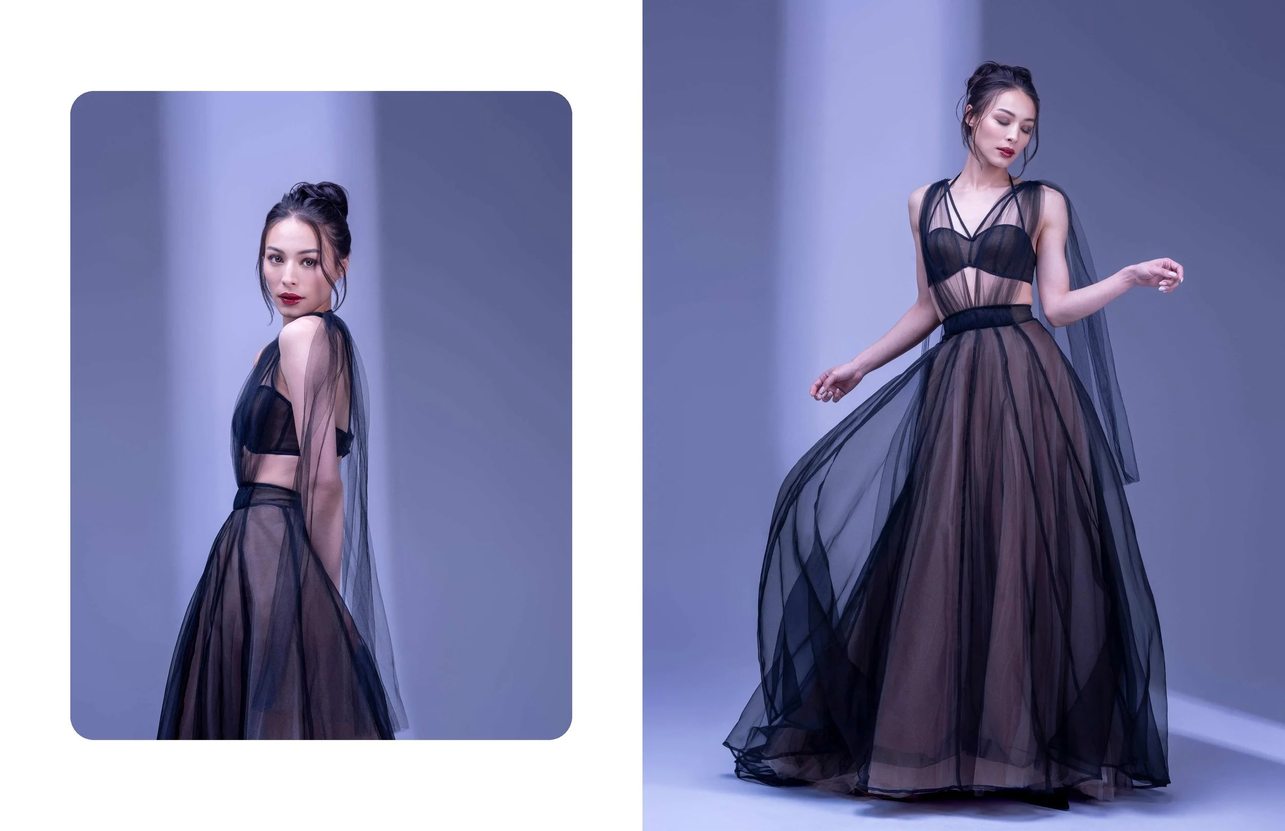 A woman with dark hair in an updo wearing a black sheer gown with layers of tulle, posing against a purple background.