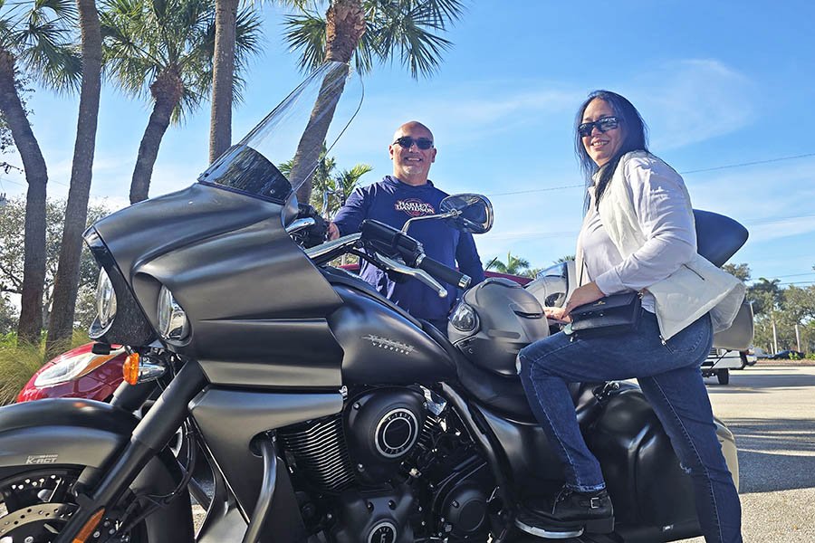 Alex and Naomi on motorcycles.
