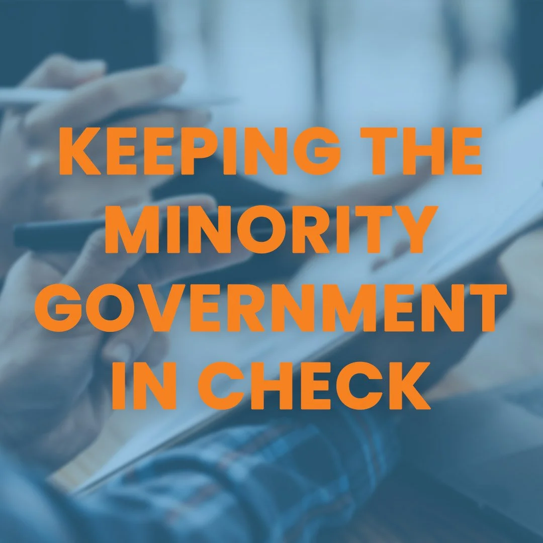 Close-up of a person wearing white gloves and holding a pen, with overlay text in bold orange reading 'Keeping the Minority Government in Check'.