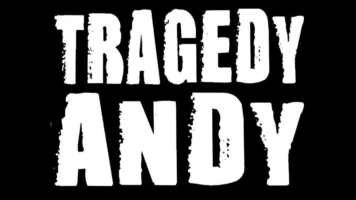 Bold White Logo spelling out Tragedy Andy