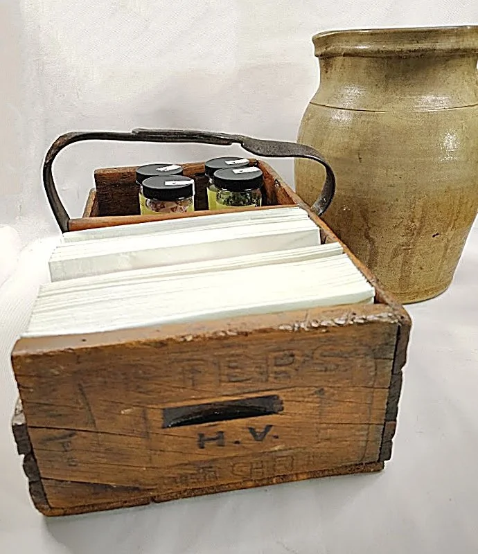 Antique-Handmaid-Wood-Carriier-Box-with-Leather-Handle -with-napkins -Penzeys Spice -Pottery-Pitcher-690 x 800.jpg