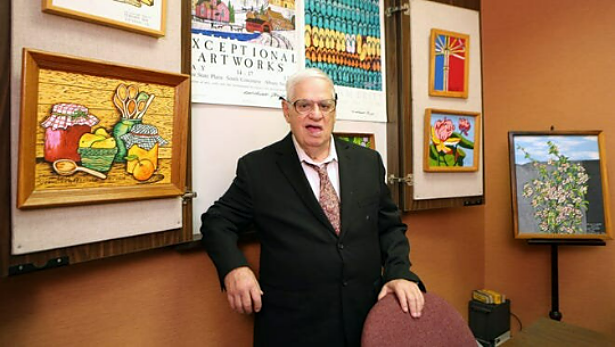 william - britt- artist-with his paintings-2000 x 1130.png