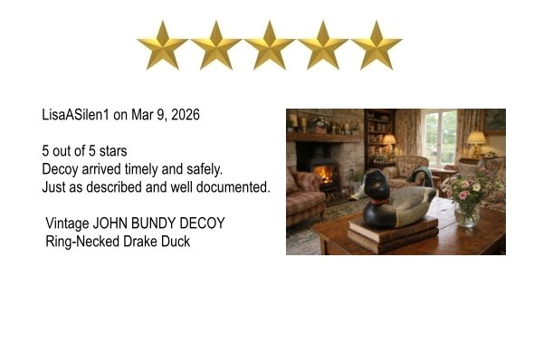 Review with five gold stars, text about a 5-star rating, a photo of a cozy living room with a fireplace, a wooden coffee table holding a decorative John Bundy Ring-Necked Drake Duck sculpture, and floral arrangements.